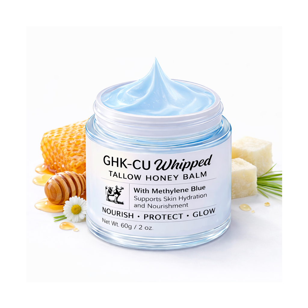 Jar of GHK-CU Whipped Tallow Honey Balm with honeycomb and soap on a white background